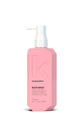 Pink bottle of Kevin Murphy hair product on a white background
