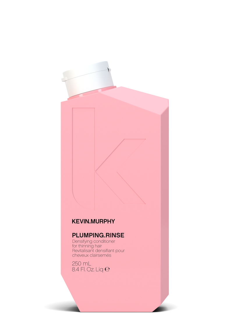 Pink bottle of Kevin Murphy Plumping Rinse on a white background