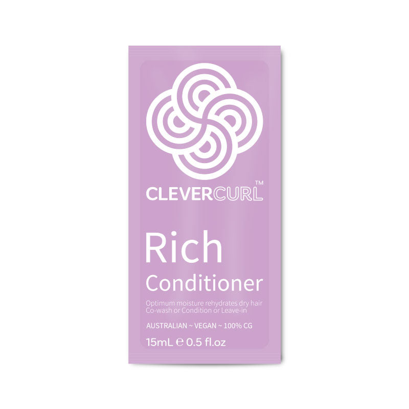 Purple packet of Clever Curl Rich Conditioner on a white background