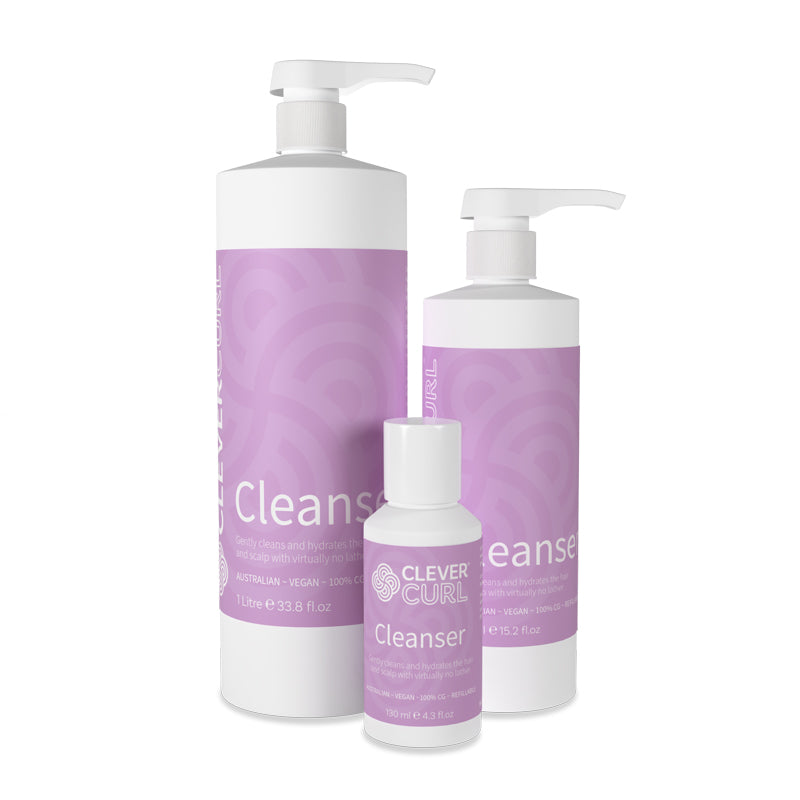 Three bottles of 'Clever Curl' Cleanser on a white background