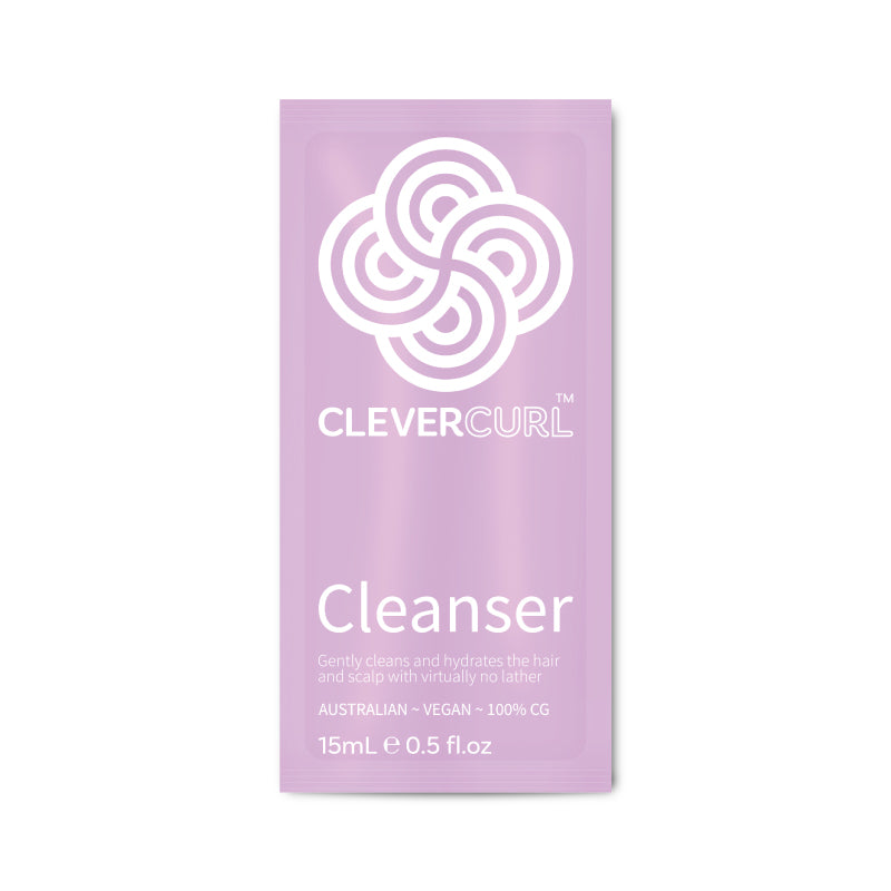 Purple packet of Clever Curl Cleanser on a white background