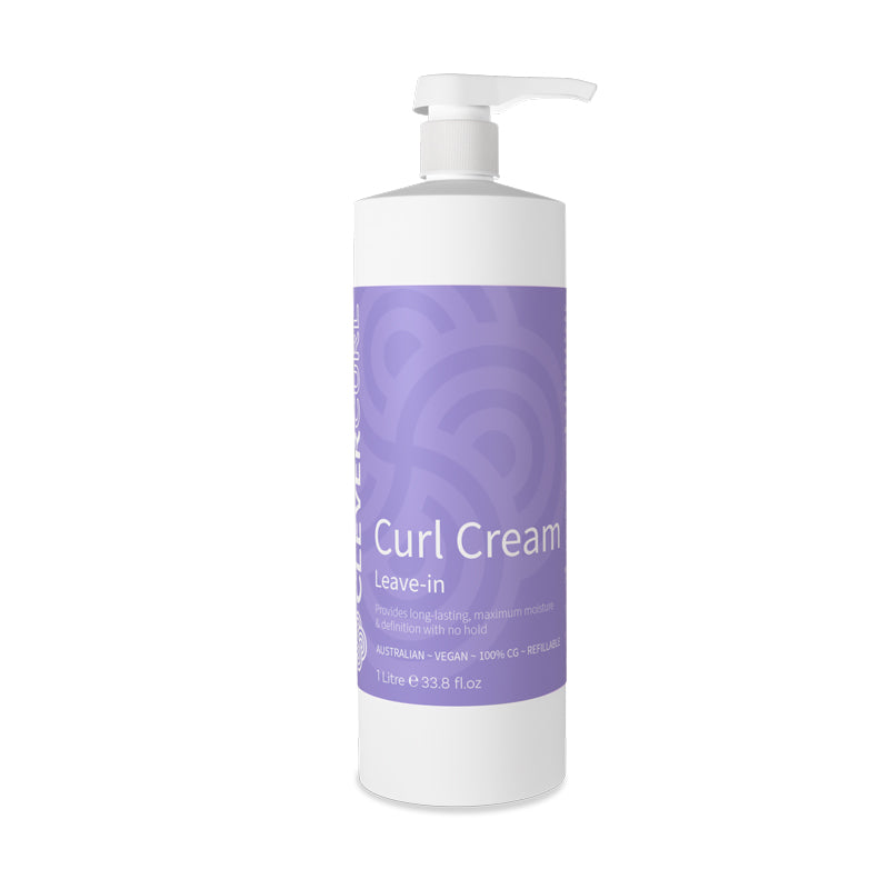 Bottle of Curl Cream with a purple label on a white background