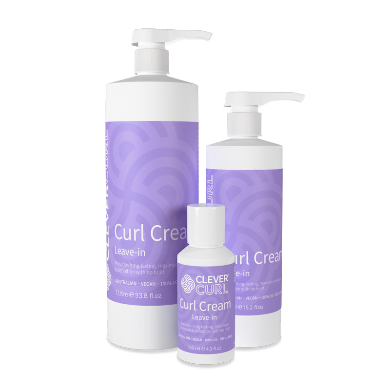 Three bottles of Curl Cream with purple labels on a white background