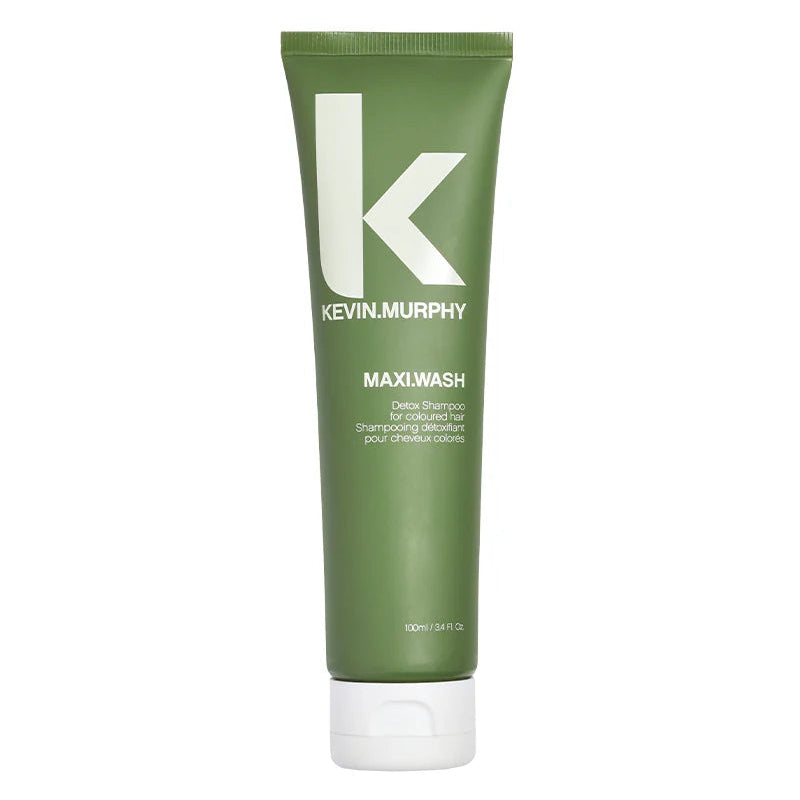 Green tube of Kevin Murphy Maxiwash hair product on a white background