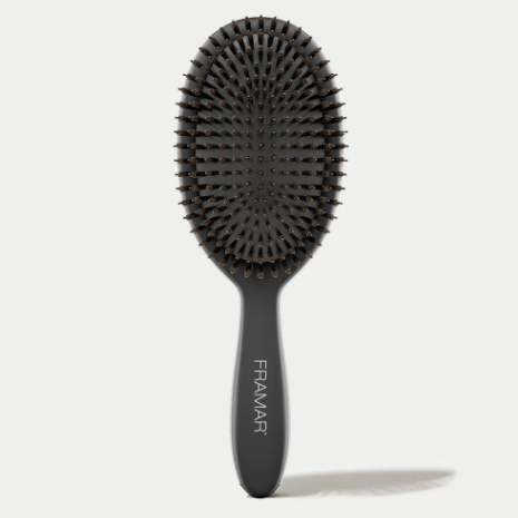 Black hairbrush with 'Framar' branding on a white background