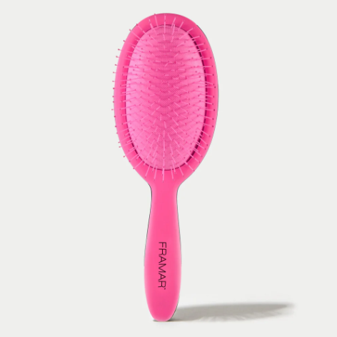 Pink hairbrush with 'Framar' branding on a white background