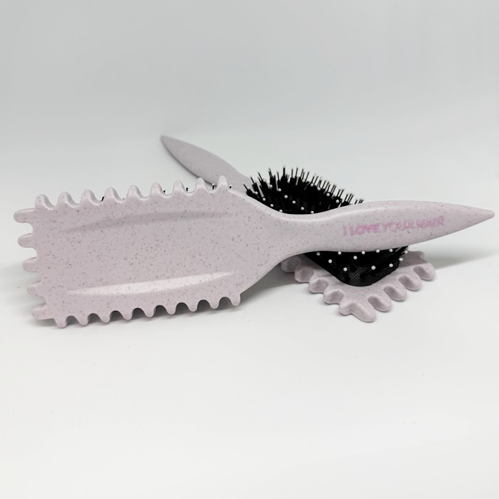 beige grey curl brush on white background with i love your hair written on the handle