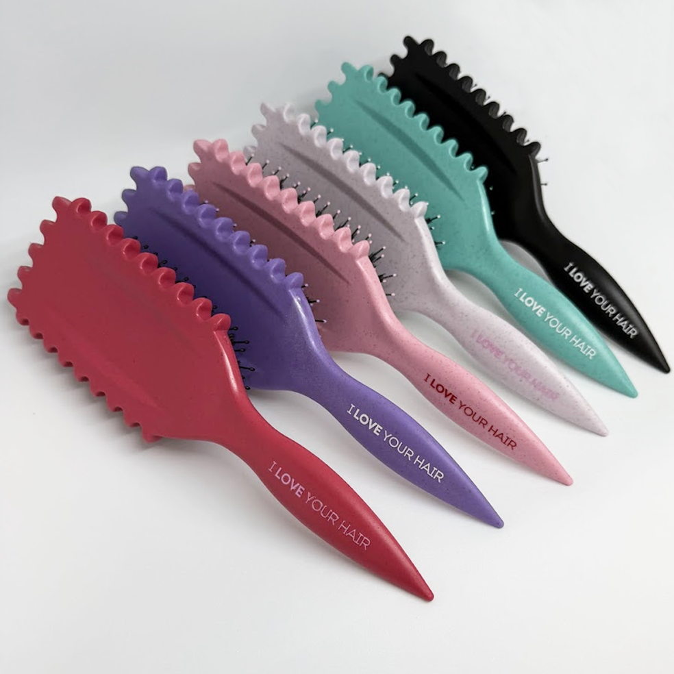 Set of colorful hairbrushes with 'I LOVE YOUR HAIR' text on a white background